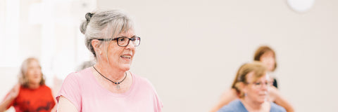 older woman exercising in an aerobics class