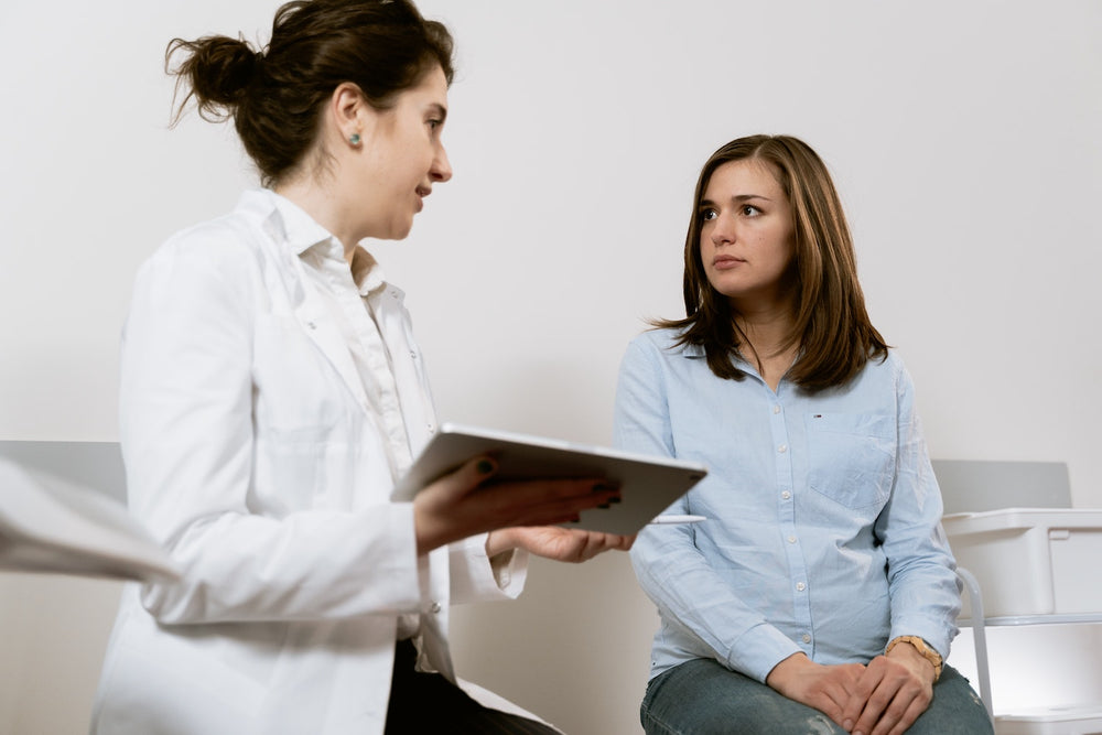 woman speaking with doctor