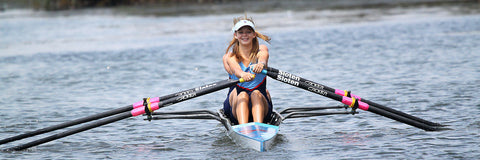Woman rowing kayak on river