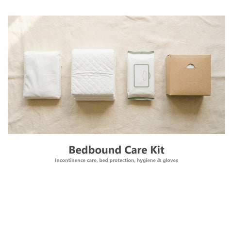 Bedbound Care Kit product layout showing Ultimate Pads, McKesson Ultra Heavy Underpads, adult washcloths, and disposable gloves arranged on a warm linen background.